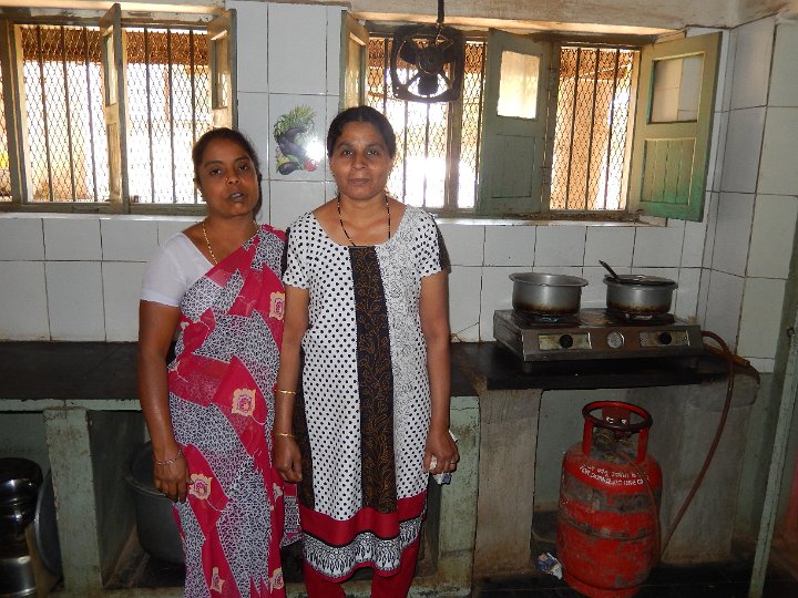 Nirmala (on Right) and helper in kitchen